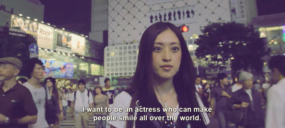 Woman being interview on the Shibuya crossing