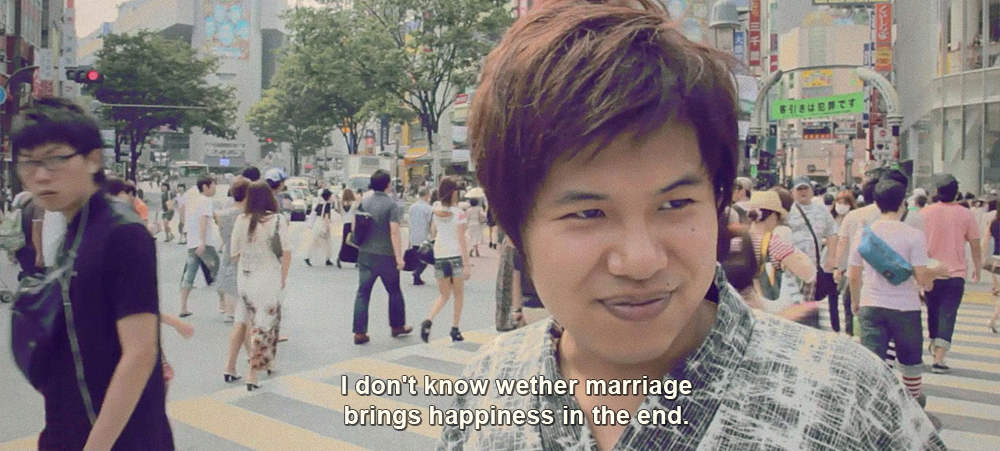 Man being interviewed on the Shibuya Crossing