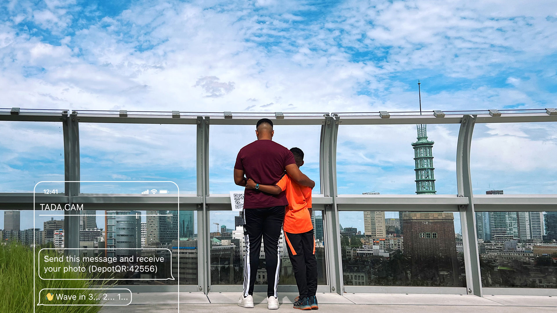 A father and son taking a picture with TADA on the roof of museum Boijmans van Beuningen